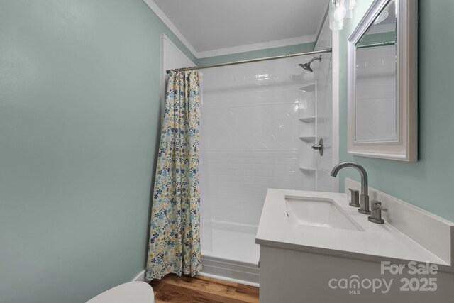 435 Stirewalt Rd, China Grove, NC 28023 - full bathroom with vanity, shower / bath combo with shower curtain, crown molding, and wood finished floors