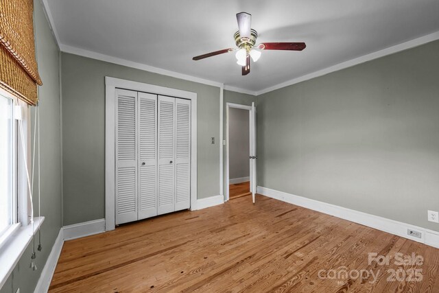 435 Stirewalt Rd, China Grove, NC 28023 - unfurnished bedroom with crown molding, wood finished floors, a closet, and a ceiling fan