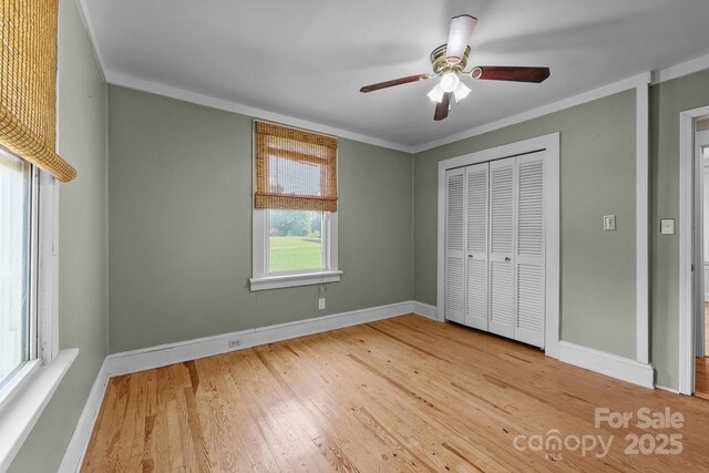 435 Stirewalt Rd, China Grove, NC 28023 - unfurnished bedroom with wood finished floors, ornamental molding, a closet, and a ceiling fan