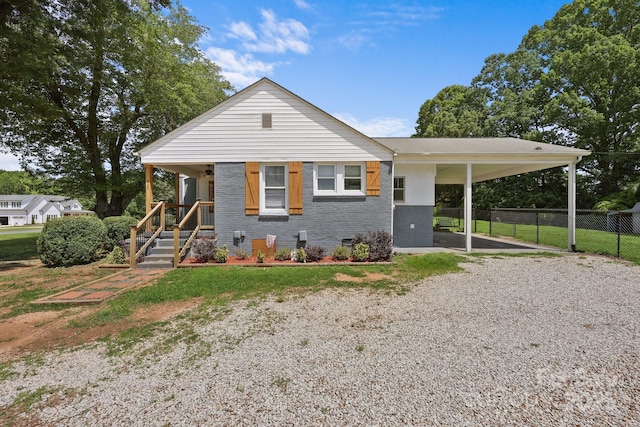 435 Stirewalt Rd, China Grove, NC 28023 - view of front of home with driveway, a carport, and brick siding