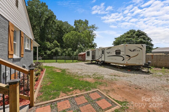 435 Stirewalt Rd, China Grove, NC 28023 - fenced backyard featuring driveway and an outbuilding