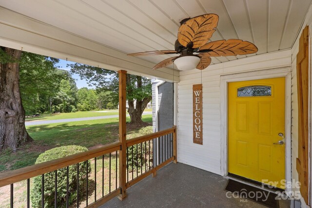 435 Stirewalt Rd, China Grove, NC 28023 - entrance to property featuring a ceiling fan, a porch, and a lawn