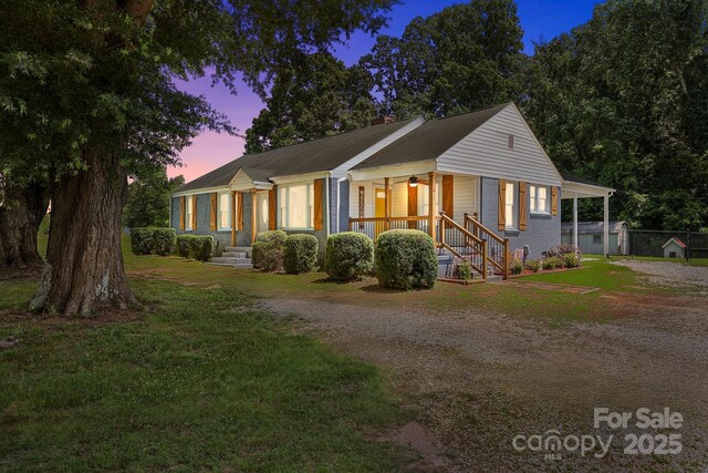 435 Stirewalt Rd, China Grove, NC 28023 - view of front of property featuring dirt driveway, a chimney, a porch, and a front yard