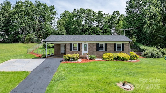 1040 Stagecoach Trl, Lenoir, NC 28645 - single story home with driveway, brick siding, a front lawn, and an attached carport