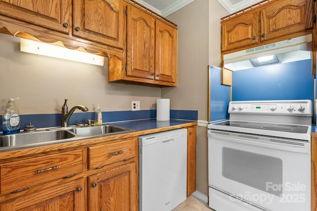 1040 Stagecoach Trl, Lenoir, NC 28645 - kitchen with white appliances, under cabinet range hood, brown cabinets, crown molding, and light tile patterned floors
