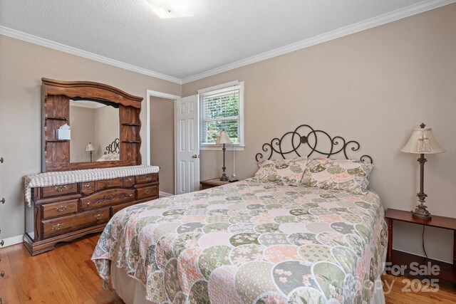 1040 Stagecoach Trl, Lenoir, NC 28645 - bedroom featuring wood finished floors and ornamental molding