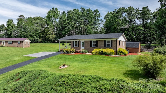 1040 Stagecoach Trl, Lenoir, NC 28645 - ranch-style house with brick siding, a front lawn, and an outbuilding
