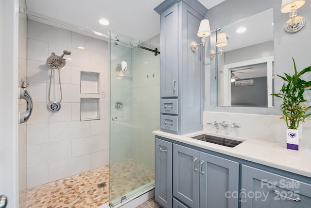 310 25th Ave NW, Hickory, NC 28601 - bathroom featuring a stall shower, vanity, a ceiling fan, and recessed lighting