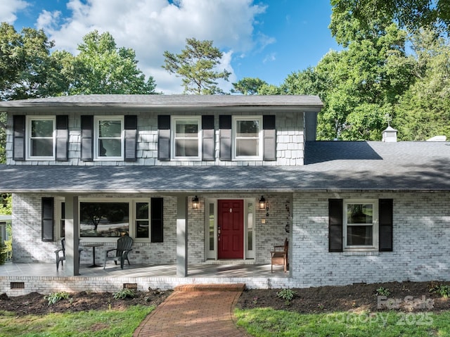310 25th Ave NW, Hickory, NC 28601 - view of front facade with covered porch, roof with shingles, and brick siding