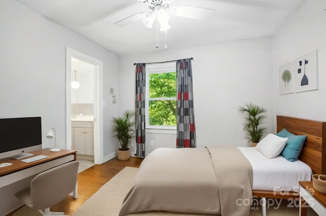 310 25th Ave NW, Hickory, NC 28601 - bedroom with light wood-style flooring, ensuite bath, a desk, and ceiling fan