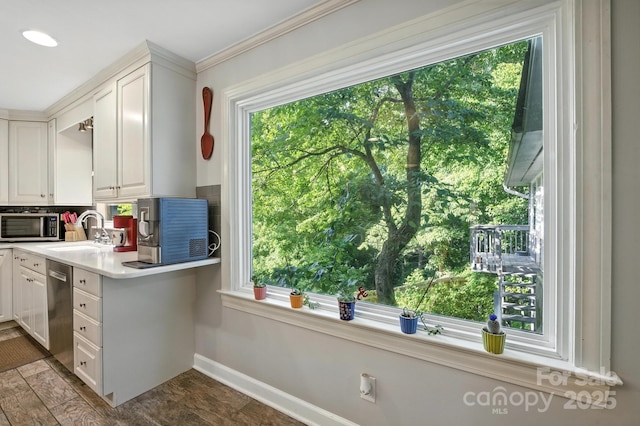 310 25th Ave NW, Hickory, NC 28601 - kitchen featuring stainless steel appliances, white cabinetry, light countertops, decorative backsplash, and ornamental molding