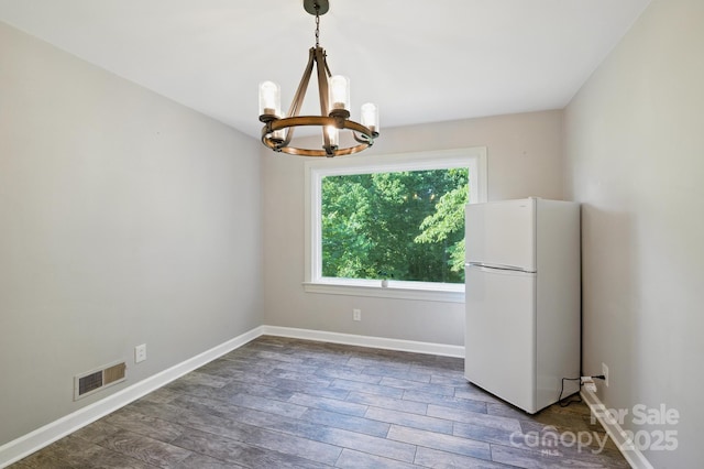 310 25th Ave NW, Hickory, NC 28601 - unfurnished room featuring a chandelier and wood finished floors