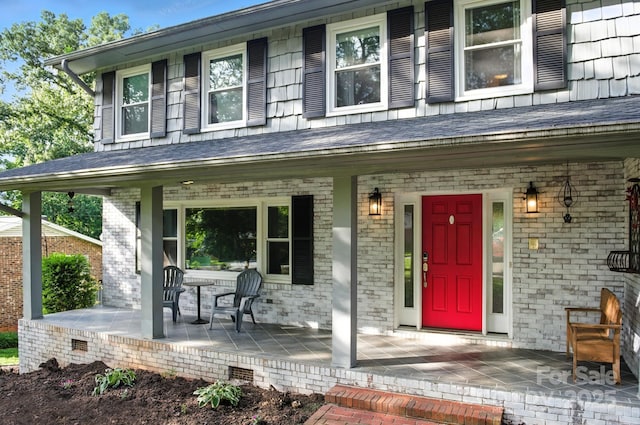 310 25th Ave NW, Hickory, NC 28601 - doorway to property with covered porch and brick siding