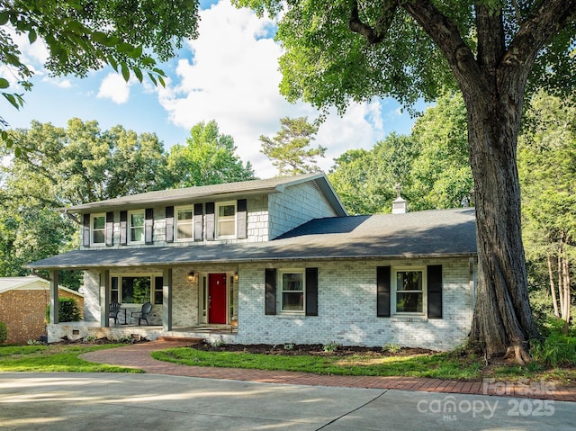 310 25th Ave NW, Hickory, NC 28601 - view of front of house with covered porch, a chimney, and brick siding