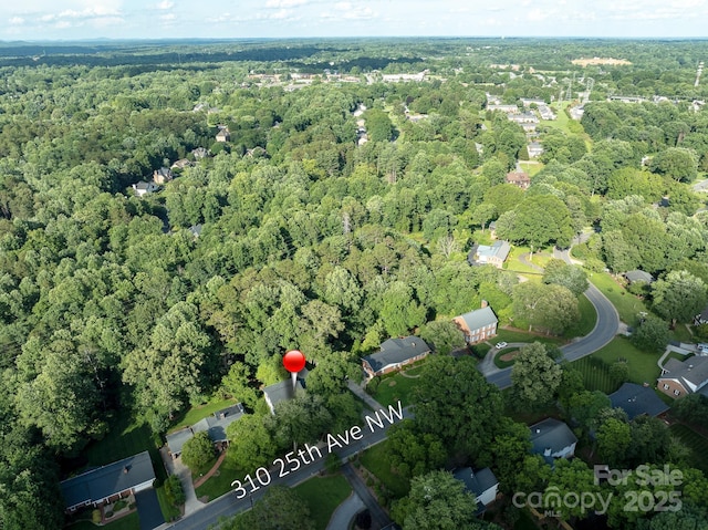 310 25th Ave NW, Hickory, NC 28601 - aerial view of property and surrounding area with a heavily wooded area