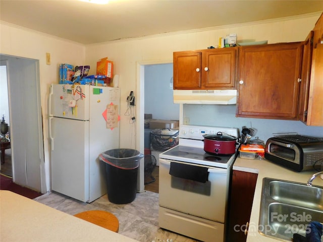 814 Aileen Cir, Pineville, NC 28134 - kitchen with white appliances, under cabinet range hood, light countertops, and brown cabinetry