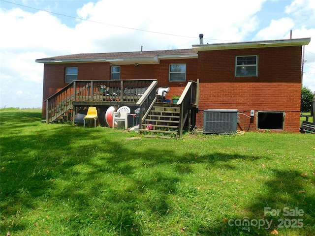 814 Aileen Cir, Pineville, NC 28134 - rear view of house with stairway, a deck, a lawn, and brick siding