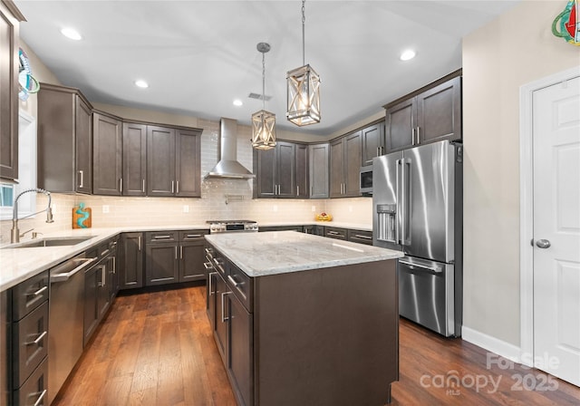 112 Steeplechase Ave, Mooresville, NC 28117 - kitchen featuring appliances with stainless steel finishes, wall chimney exhaust hood, dark brown cabinets, dark wood-style floors, and light stone counters