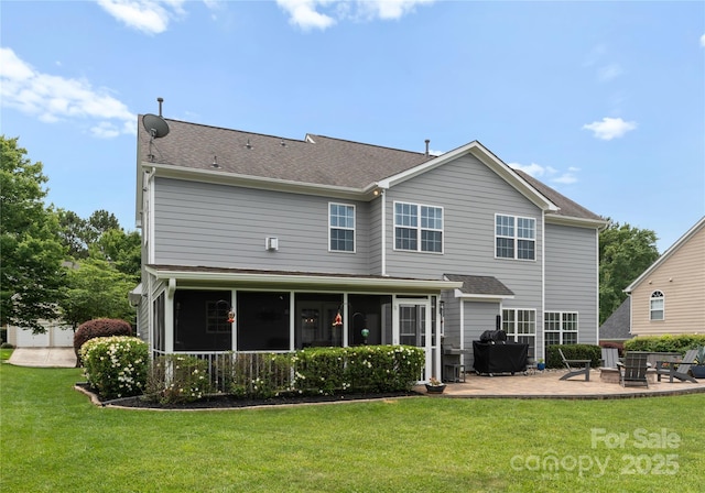 112 Steeplechase Ave, Mooresville, NC 28117 - rear view of property featuring a sunroom, a patio area, a yard, and roof with shingles