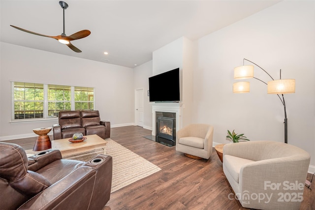 7739 Village Pkwy, Locust, NC 28097 - living room featuring ceiling fan, a fireplace with flush hearth, and wood finished floors