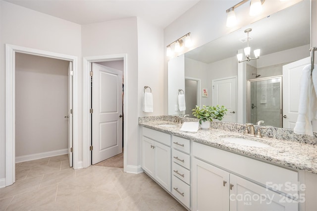 7739 Village Pkwy, Locust, NC 28097 - full bath with double vanity, a stall shower, and a chandelier