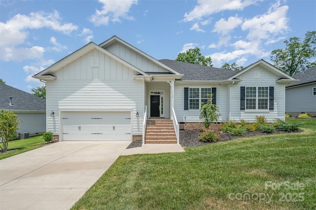 7739 Village Pkwy, Locust, NC 28097 - view of front of house featuring board and batten siding, a front yard, driveway, and an attached garage