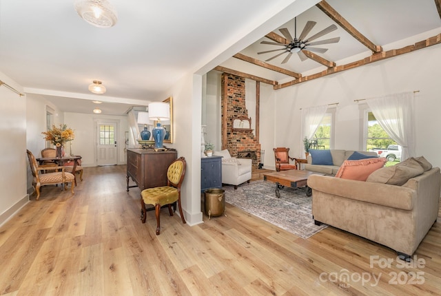 220 Low Water Bridge Rd, Troy, NC 27371 - living room with light wood finished floors, ceiling fan, and beamed ceiling