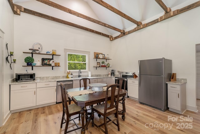 220 Low Water Bridge Rd, Troy, NC 27371 - dining space featuring high vaulted ceiling, light wood-type flooring, and beamed ceiling