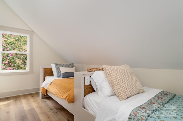 220 Low Water Bridge Rd, Troy, NC 27371 - bedroom featuring lofted ceiling and light wood-style floors