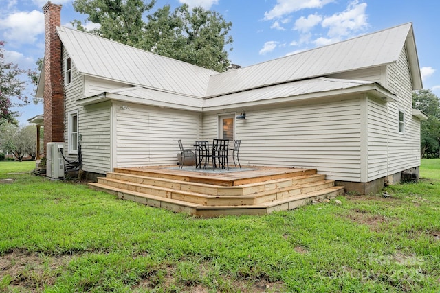 220 Low Water Bridge Rd, Troy, NC 27371 - rear view of property featuring a deck, a chimney, a lawn, a metal roof, and outdoor dining area