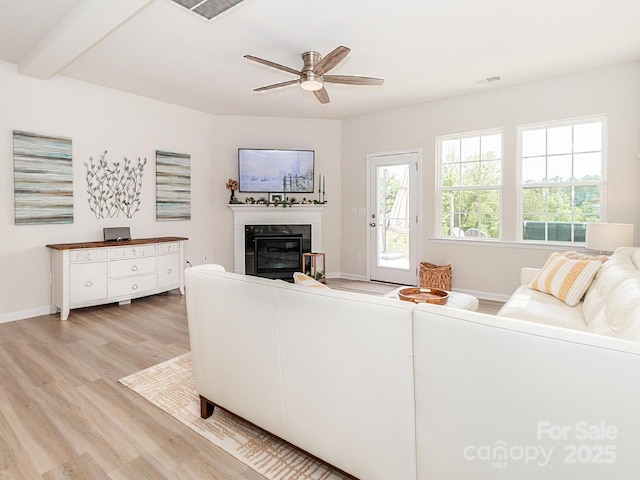 4268 Coachwhip Ave, Lancaster, SC 29720 - living room featuring light wood finished floors, a tile fireplace, and a ceiling fan