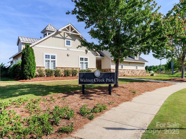 4268 Coachwhip Ave, Lancaster, SC 29720 - view of front facade with stone siding, a front lawn, and a standing seam roof