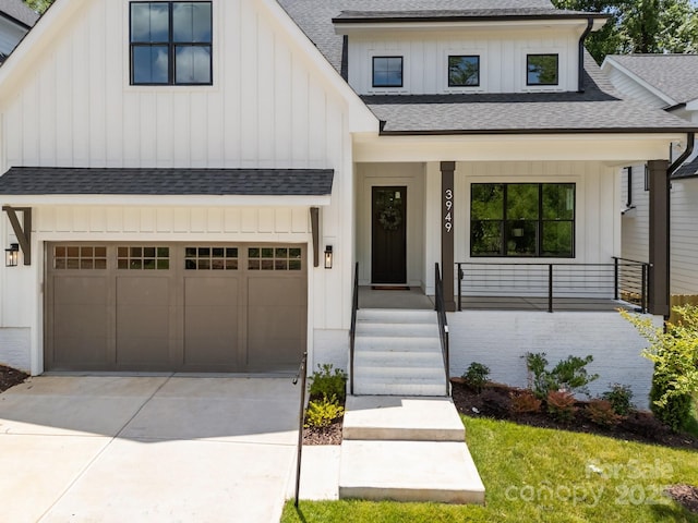 3949 Plainview Rd, Charlotte, NC 28208 - modern farmhouse featuring roof with shingles, board and batten siding, concrete driveway, and covered porch