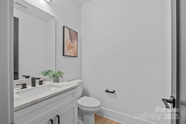 3949 Plainview Rd, Charlotte, NC 28208 - half bath with vanity and wood finished floors