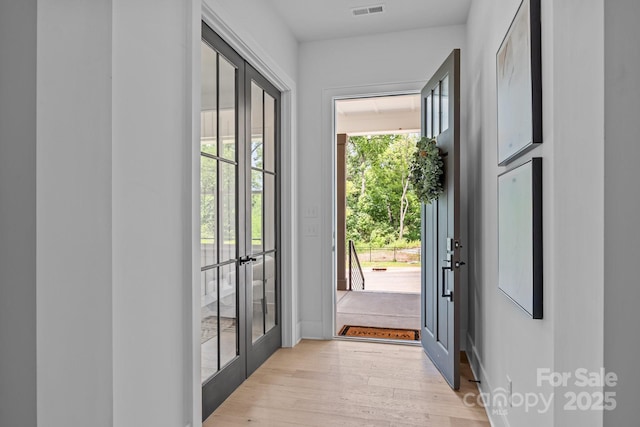 3949 Plainview Rd, Charlotte, NC 28208 - doorway to outside with french doors and light wood-style flooring