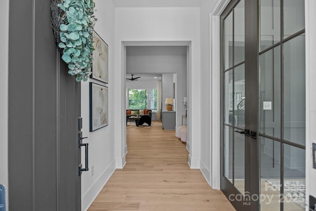 3949 Plainview Rd, Charlotte, NC 28208 - entryway featuring french doors, light wood-style flooring, and a ceiling fan
