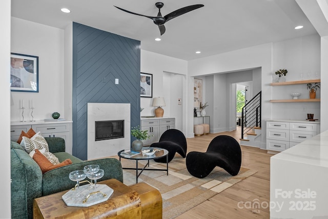3949 Plainview Rd, Charlotte, NC 28208 - living area with light wood finished floors, stairs, ceiling fan, a fireplace, and recessed lighting