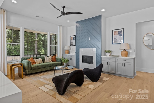 3949 Plainview Rd, Charlotte, NC 28208 - living area with a ceiling fan, light wood-type flooring, a high end fireplace, and recessed lighting