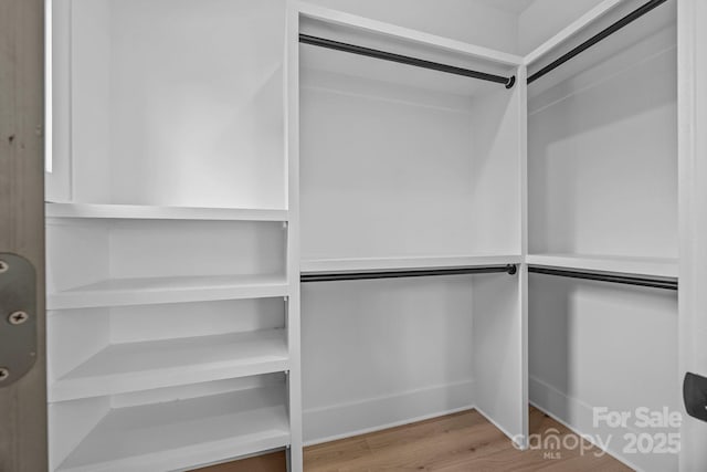3949 Plainview Rd, Charlotte, NC 28208 - walk in closet featuring wood finished floors