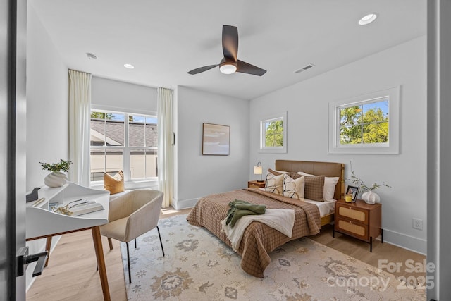 3949 Plainview Rd, Charlotte, NC 28208 - bedroom with wood finished floors, ceiling fan, and recessed lighting
