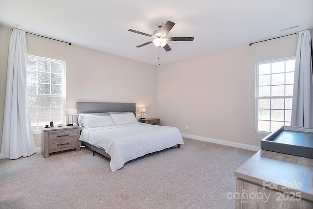 4017 Avis Way, Monroe, NC 28110 - bedroom with multiple windows, light colored carpet, and ceiling fan