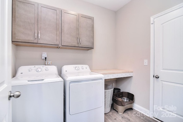 4017 Avis Way, Monroe, NC 28110 - laundry room featuring cabinet space, independent washer and dryer, and light wood finished floors