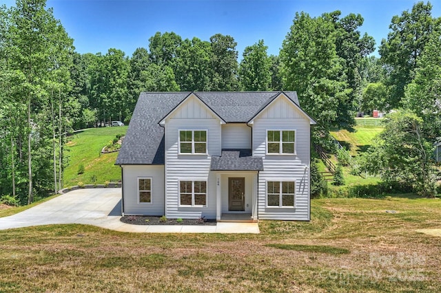 164 Meadow Glen Dr, Troutman, NC 28166 - view of front facade with board and batten siding, a front yard, and a shingled roof