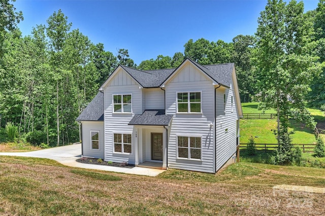 164 Meadow Glen Dr, Troutman, NC 28166 - view of front of house with board and batten siding and roof with shingles