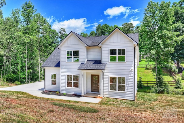 164 Meadow Glen Dr, Troutman, NC 28166 - view of front of property featuring board and batten siding and roof with shingles