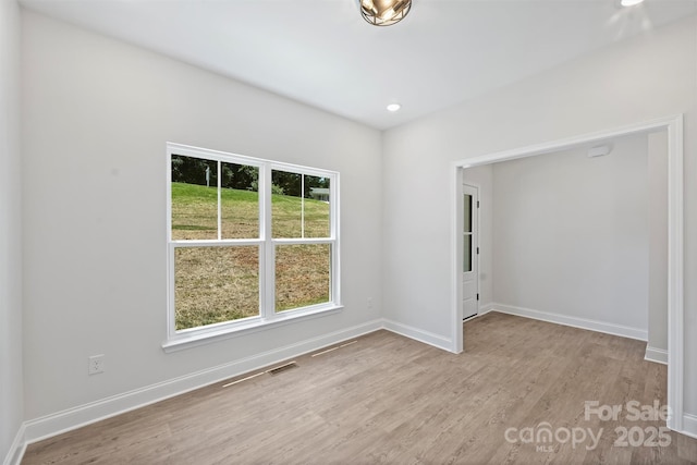 164 Meadow Glen Dr, Troutman, NC 28166 - spare room with wood finished floors and recessed lighting