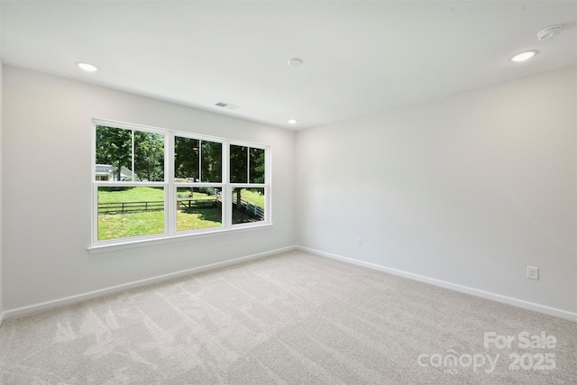 164 Meadow Glen Dr, Troutman, NC 28166 - spare room with carpet, a smoke detector, and recessed lighting