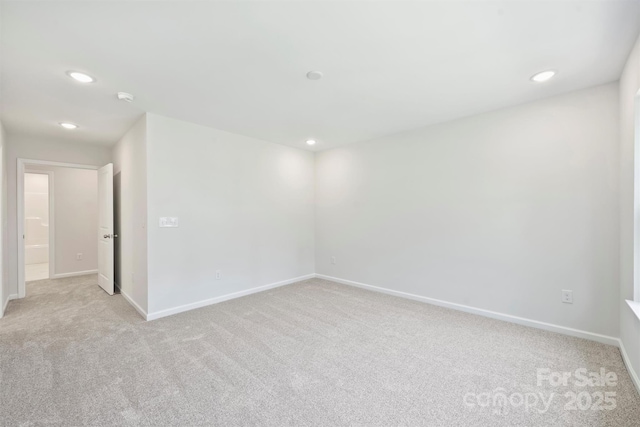 164 Meadow Glen Dr, Troutman, NC 28166 - spare room with light colored carpet, recessed lighting, and a smoke detector
