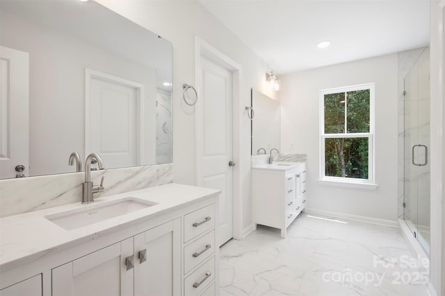 164 Meadow Glen Dr, Troutman, NC 28166 - full bathroom with marble finish flooring, a marble finish shower, two vanities, and recessed lighting