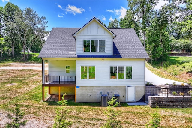 164 Meadow Glen Dr, Troutman, NC 28166 - back of property with a yard, a wooden deck, board and batten siding, and roof with shingles